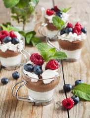 White chocolate and milk chocolate mousse with berries and merin