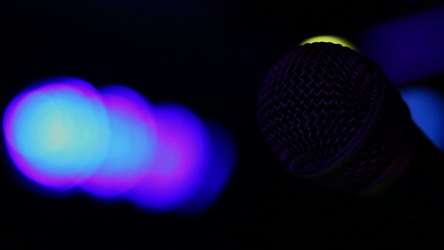 Microphone and concert lights turning on and off.