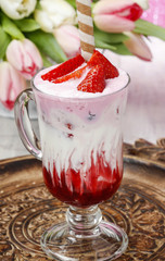 Strawberry milkshake, beautiful bouquet of pink and white tulips