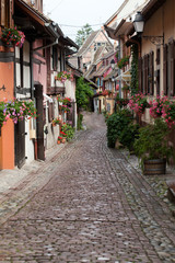 Obraz na płótnie Canvas Street with half-timbered medieval houses in Eguisheim