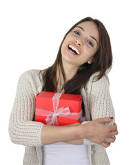 beautiful girl embracing red gift pack