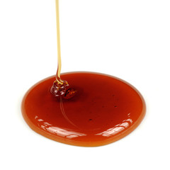 Dripping Honey on White Background