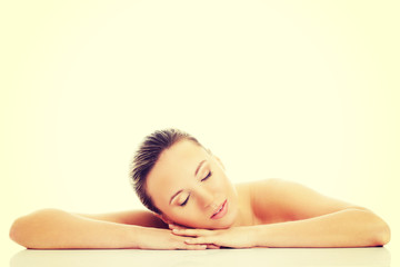 Fototapeta premium Beautiful woman is lying on her hands.