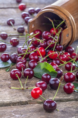 healthy organic cherries spilled on old rustic table