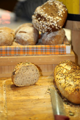 Baked bread with poppy and cutting knife.