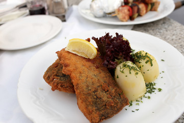 Fried carp with potatoes