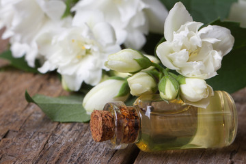 fragrant oil of jasmine flowers macro horizontal.