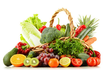 Wicker basket with groceries isolated on white © monticellllo