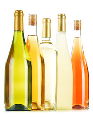 Composition with variety of wine bottles isolated on white