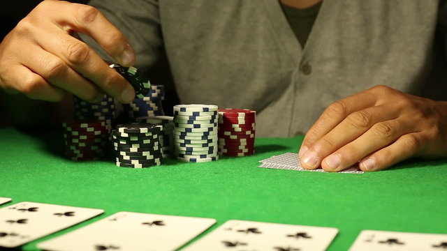 Anonymous male going all in during a Poker game