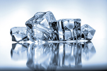 Ice cubes on blue background