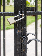 Closed padlock and gate