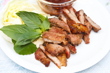 Grilled beef steak with spicy sauce.