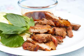 Grilled beef steak with spicy sauce.