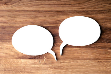 Speech Bubble on wooden Background.