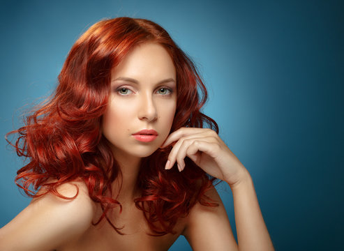 Fashion Woman Portrait. Long Curly Red Hair.