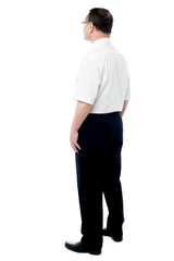 Fototapeta premium Side view of a businessman standing