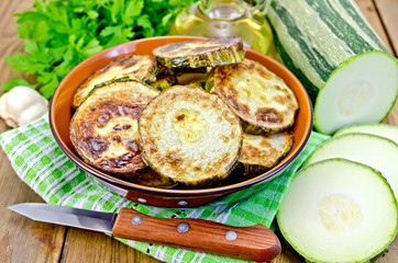 Zucchini fried with napkin on board