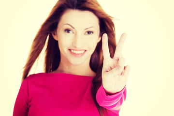 Woman showing victory sign