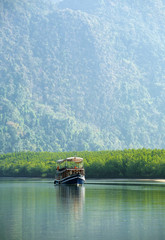 blue thai wooden boat in thailand