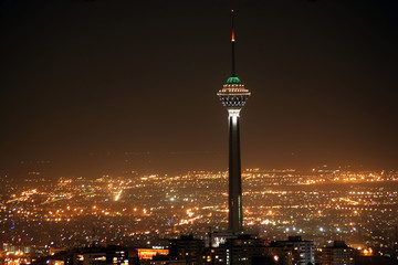 Tehran skyline and illuminated Milad Tower at night, Tehran, Ira