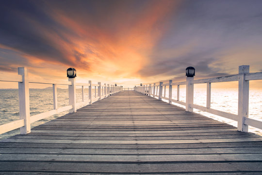 Fototapeta old wood bridg pier with nobody against beautiful dusky sky use