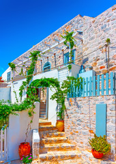 old  house over the main port of Hydra island in Greece - 65907235