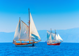 Fototapeta premium 2 Old classic wooden sailing boats in Spetses island in Greece
