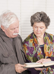 Elderly couple with a bible