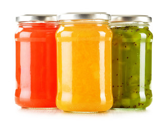 Jars of fruity jams isolated on white background