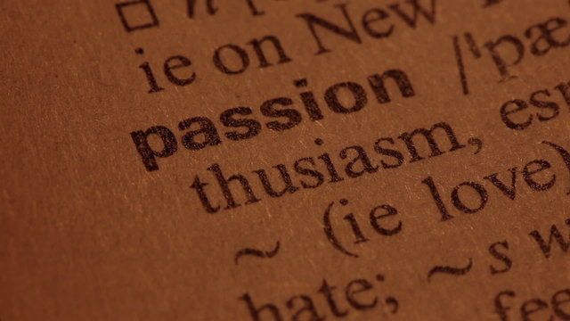 Word Passion in a dictionary. Lit with a spotlight. Three simila
