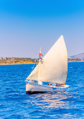 Naklejka premium Classic wooden Greek boat (Kaiki) in Spetses island in Greece