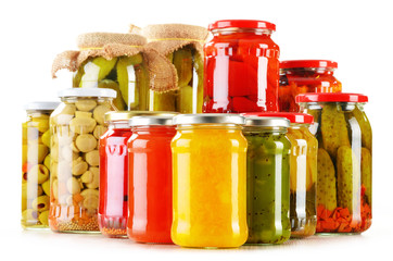 Composition with jars of pickled vegetables. Marinated food