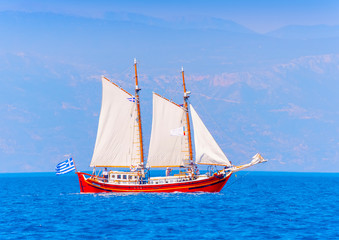 Fototapeta premium Old wooden red Greek boat (Perama) in Spetses island in Greece