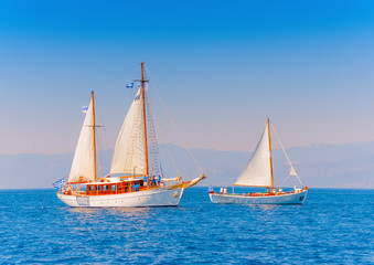 Fototapeta premium 2 Old classic wooden sailing boats in Spetses island in Greece