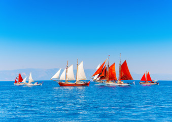 several old wooden sailing boats in Spetses island in Greece