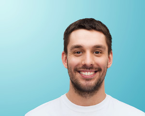 Fototapeta premium portrait of smiling young handsome man