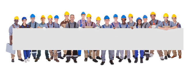 Multiethnic Manual Workers Holding Blank Banner