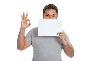 Asian strong man show OK sign and a blank sign