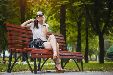Young Woman with smartphone in the park
