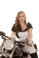 Fototapeta na wymiar woman on motorcycle sit legs to side white black