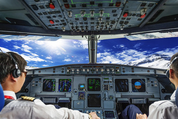 Fototapeta premium Pilots in the plane cockpit