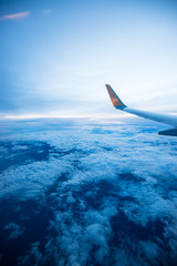 Fototapeta na wymiar Cloud sky on airplane in evening