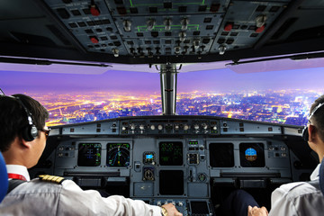 plane cockpit and city of night