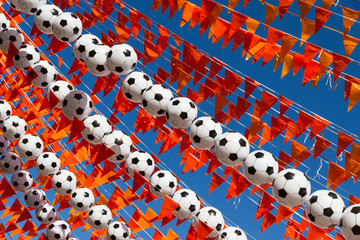 Orange flags and footballs during world cup 2014