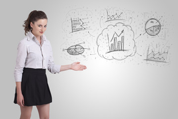 Business girl presenting hand drawn sketch graphs and charts