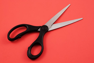 Scissors On A Red Background