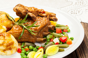 Pork spareribs served with mashed potatoes