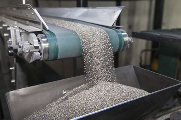 Conveyor belt carrying industrial powder