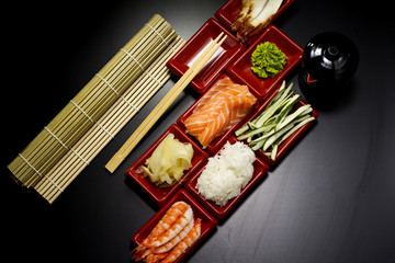 Fototapeta na wymiar Ingredients for sushi: sliced salmon cucumber rice 